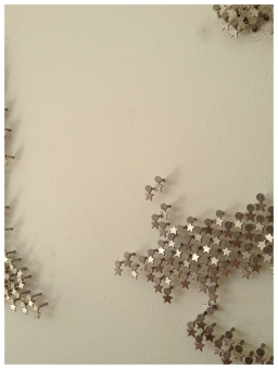 DETAIL - 2013 DETAIL – 2013 Metal star charms on stainless steel nails on white lacquered panel