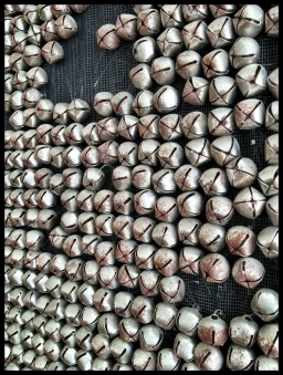 JINGLE BELL JESUS DETAIL – 2006 JINGLE BELL JESUS DETAIL – 2006 Jingle bells on wool felt and nylon screen hanging on steel rods – 78” x 90”